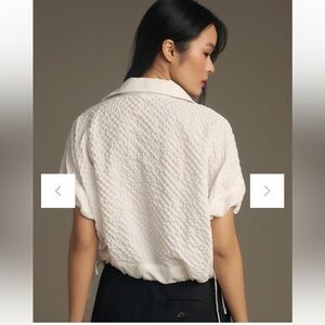 Self Contrast white bubble fabric pullover top. Button front. Size S